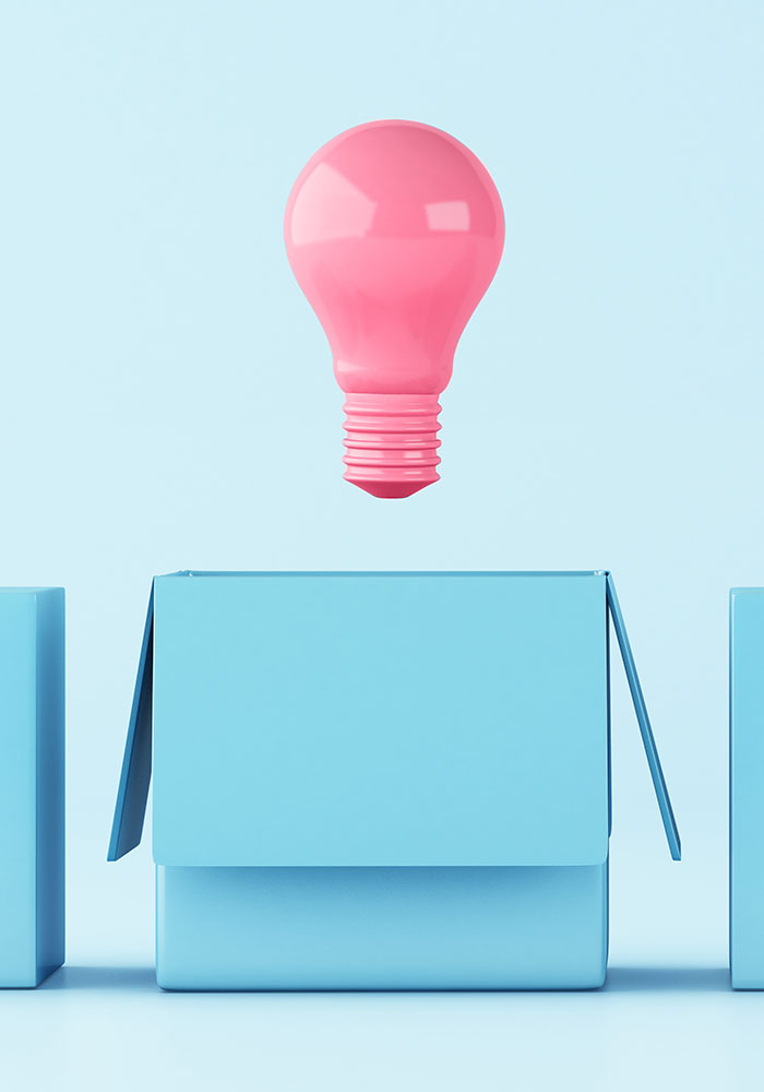 illustration of a pink light bulb hovering over a open blue box